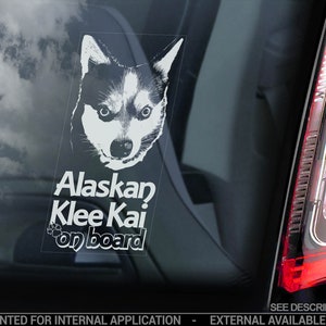 May include: White sticker with a black and white image of a Siberian Husky dog with the text "Alaskan Klee Kai on board".