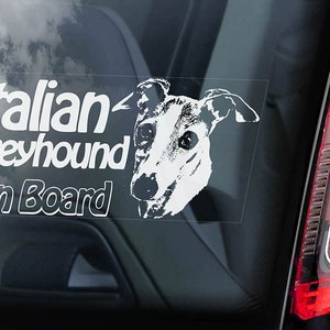 May include: White car window sticker with a black and white illustration of an Italian Greyhound dog and the text "Italian Greyhound On Board".