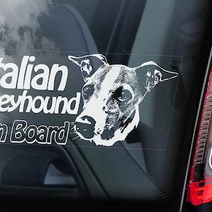 May include: White car window sticker with a black and white illustration of an Italian Greyhound dog's head and the text "Italian Greyhound On Board".
