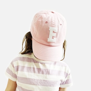 May include: A set of three ceramic mugs with a speckled, matte finish. The mugs are in shades of cream, light gray, and dark gray. Each mug has a simple, minimalist design and a rounded handle.