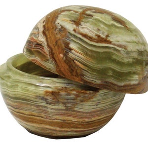 May include: A green and brown marble trinket box with a lid. The box is round and has a swirling pattern.