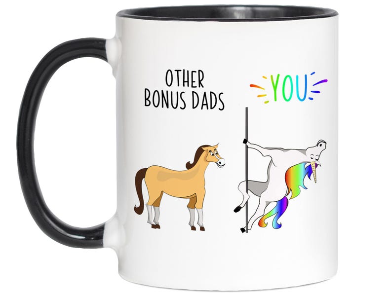 May include: White ceramic mug with a black handle and rim. The mug features the text "OTHER BONUS DADS" and "YOU" with a cartoon horse and a unicorn. The unicorn is pole dancing.