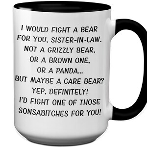 May include: White ceramic mug with a black interior and handle. The mug features the text "I WOULD FIGHT A BEAR FOR YOU, SISTER-IN-LAW..." in black font. A humorous gift idea for a sister-in-law.