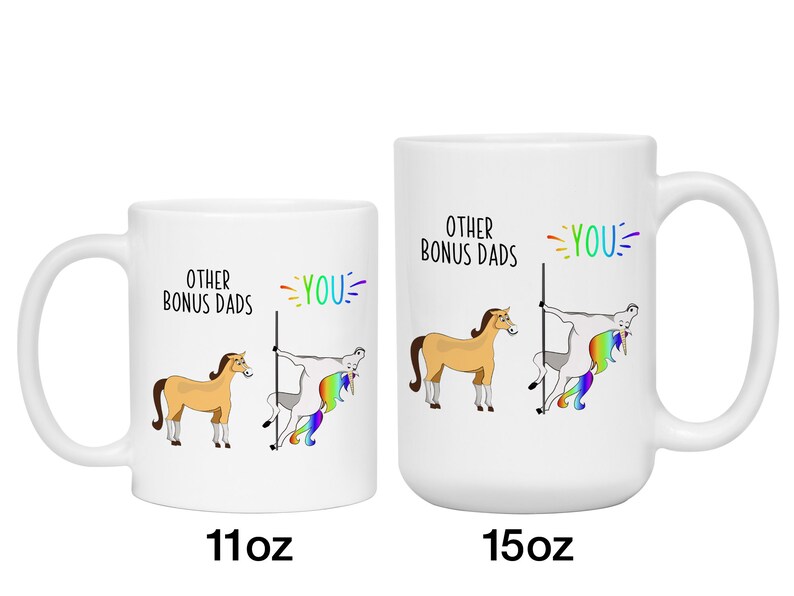 May include: White ceramic mugs with a humorous design. One mug is labeled "11oz" and the other "15oz". The design features a cartoon horse and a unicorn, with the text "OTHER BONUS DADS" and "YOU" in rainbow colors.