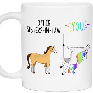 May include: White coffee mug with the text "Other Sisters-in-Law" and "You" with a cartoon horse and unicorn illustration. The unicorn is holding a pole and has a rainbow mane and tail.