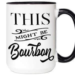 Puede incluir: Taza de cer&aacute;mica blanca con asa y borde negros. La taza presenta el texto "THIS MIGHT BE Bourbon" en letras negras y estilizadas. Un art&iacute;culo decorativo para la cocina o el bar.