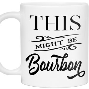 Puede incluir: Taza de cer&aacute;mica blanca con el texto "THIS MIGHT BE Bourbon" en negro. La taza tiene un asa curva y un dise&ntilde;o sencillo, ideal para caf&eacute; o t&eacute;.