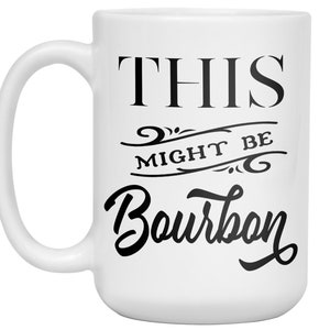 Puede incluir: Taza de cer&aacute;mica blanca con un asa grande. La taza presenta el texto "THIS MIGHT BE Bourbon" en negro, con letras estilizadas. El dise&ntilde;o incluye adornos decorativos encima y debajo de la palabra "might".