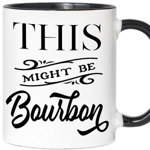 Puede incluir: Taza de cer&aacute;mica blanca con asa y borde negros. La taza presenta el texto "THIS MIGHT BE Bourbon" en negro, con letras estilizadas. Una l&iacute;nea decorativa se encuentra entre "THIS" y "Bourbon".