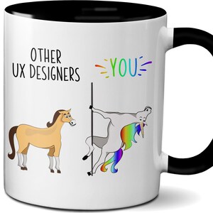 May include: White ceramic mug with a black interior and handle. The mug features a humorous design with a horse and a unicorn, along with the text "OTHER UX DESIGNERS" and "YOU". The unicorn has a rainbow mane.