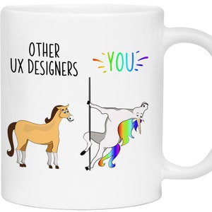 May include: White ceramic mug with a humorous design. The mug features the text "OTHER UX DESIGNERS" above a cartoon horse and "YOU" above a cartoon unicorn pole dancing. The unicorn has a rainbow mane and tail.