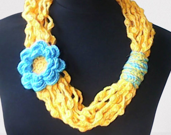 Yellow mulberry tree scarf with large blue crochet flower