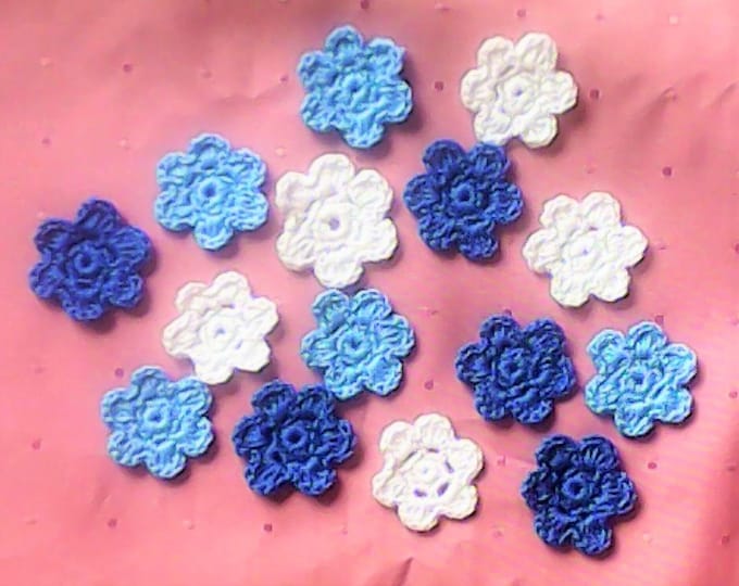 Crochet flower appliques in white, dark blue and light blue cotton for sewing and scrapbooking