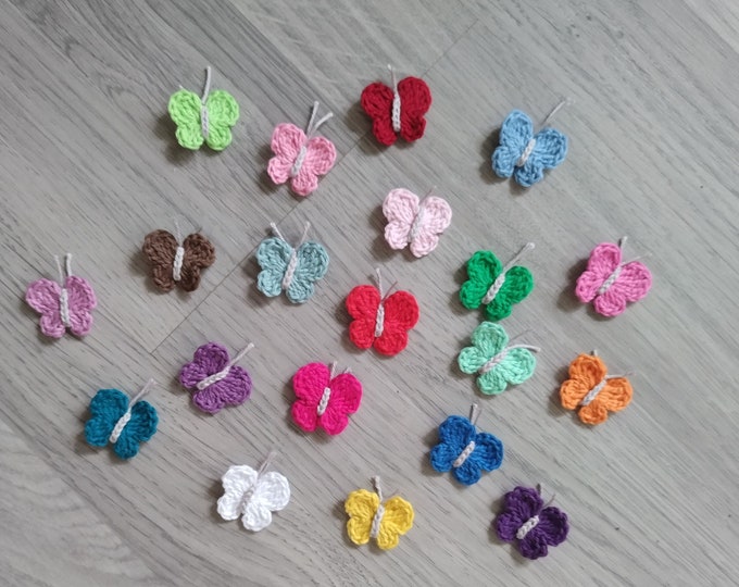 Applications of small crocheted butterflies in a colorful mix, small embellishments to sew