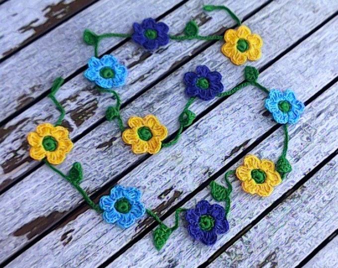 Crocheted mini garland with 10 small, colorful flowers, blue and yellow