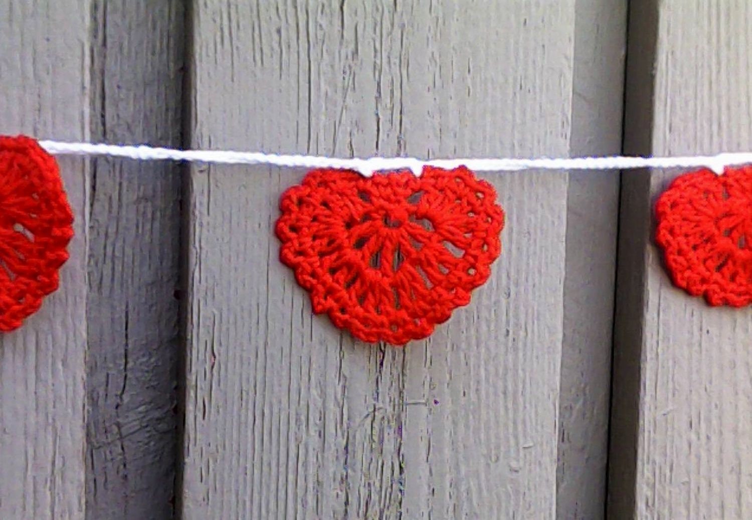 Crocheted garland with red hearts for Valentine's Day and Wedding
