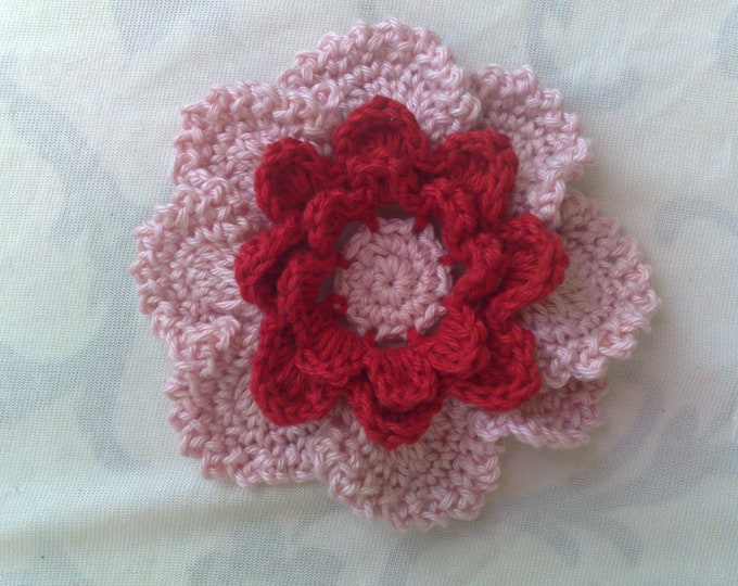 Large crocheted flower applique for sewing on children's clothing