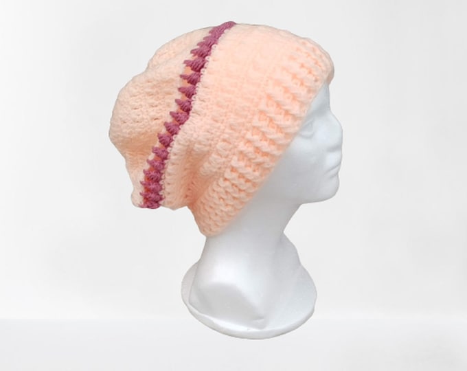 Cap crocheted in acrylic apricot with a strip in old pink