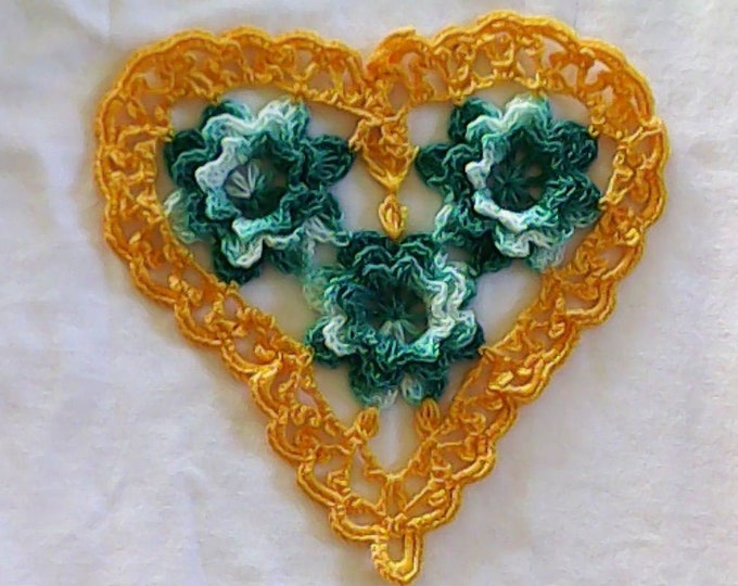 Thanksgiving Yellow crocheted heart-shaped doily with 3D crochet flowers in turquoise