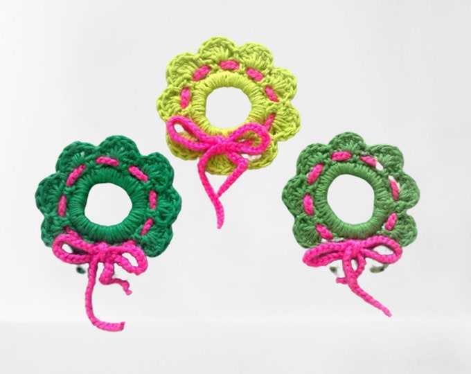 Crochet Christmas wreath hanging tree hanging in three different shades of green