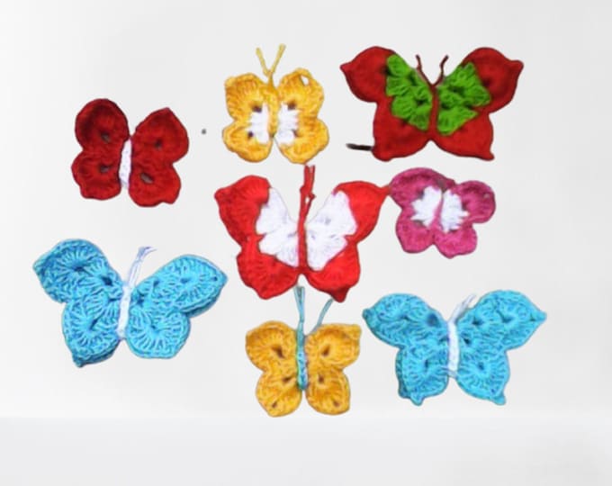 Crocheted butterfly applications. Set of 8 crocheted butterfly applications in different sizes and colors