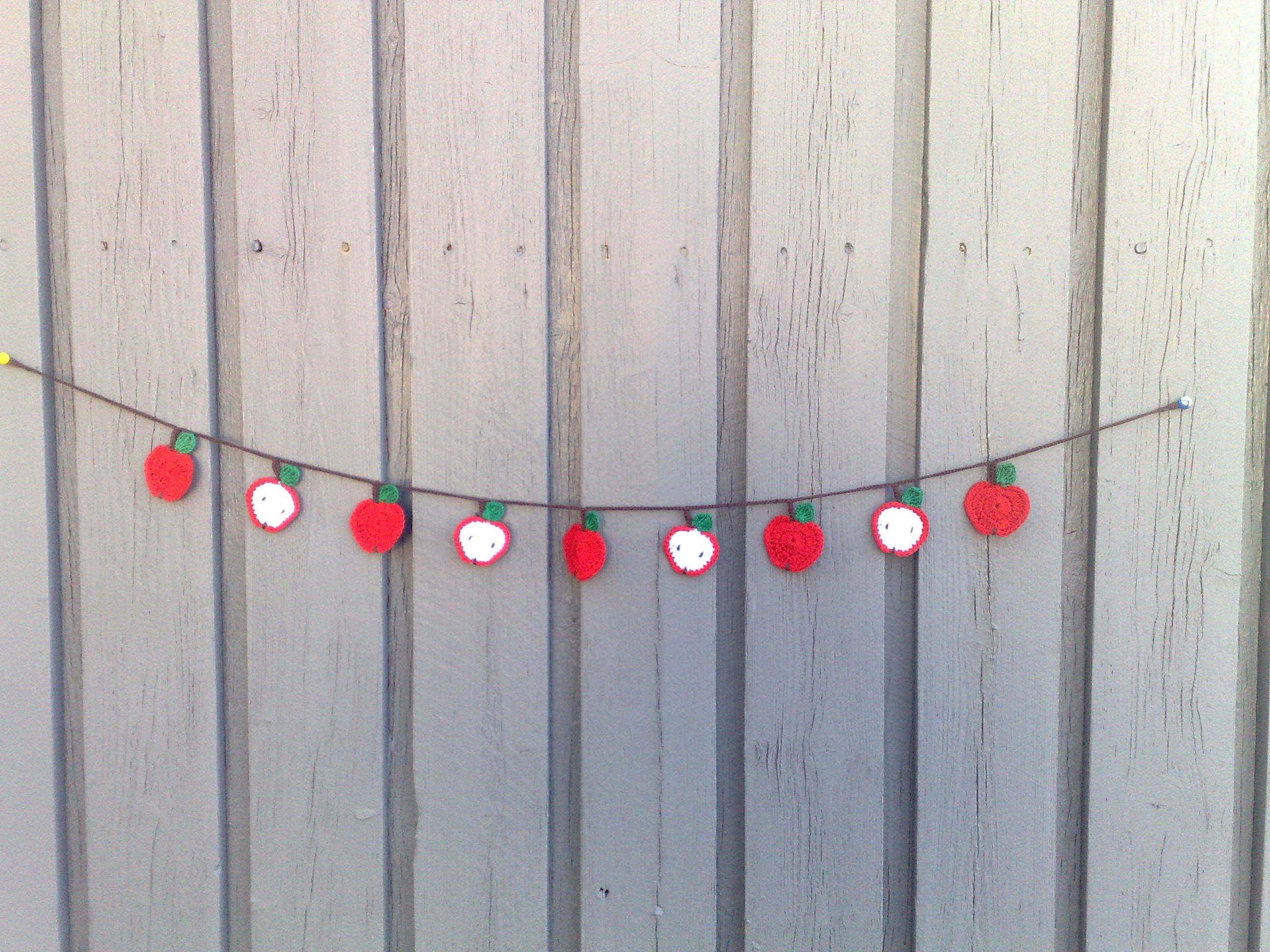 Crocheted garland with red apples