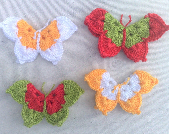 Crocheted butterfly applications three-dimensionally in a colorful mix for decorative embellishments