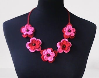 Crochet necklace with pink and red flowers in boho style