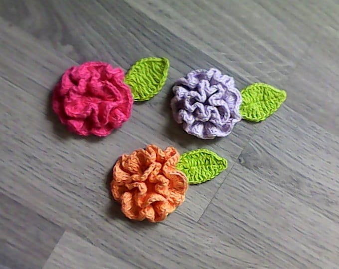 Crocheted carnations with a leaf in orange, light purple and dark pink for scrapbooking 3 pieces 2.5-inch