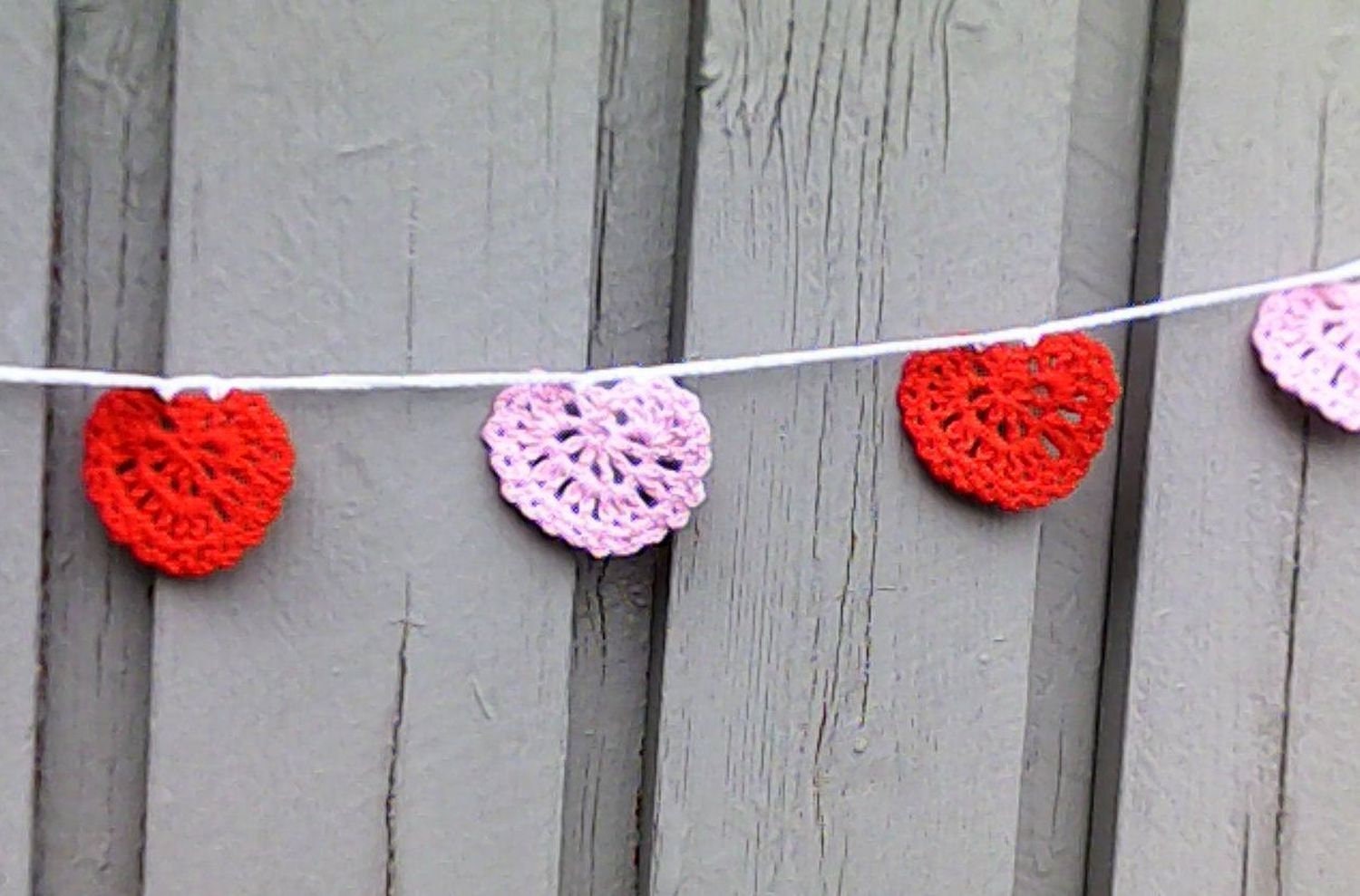 Bunting garland crocheted with pink and red hearts Valentine's Day