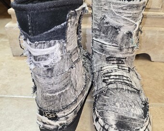 May include: A pair of distressed denim boots with a black sole and a black, faux-fur lined collar. The boots have a shredded, worn look, with the UGG logo visible on the heel.
