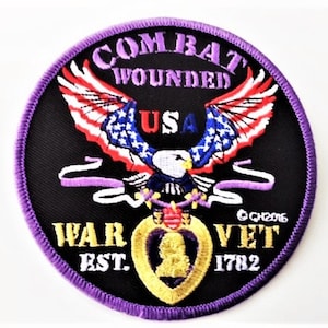 May include: Purple embroidered patch with a bald eagle holding a purple heart, a ribbon, and a banner that reads "Combat Wounded USA War Vet Est. 1782".