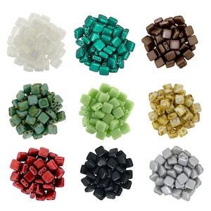 May include: A collection of nine piles of square-shaped, two-hole beads arranged in a grid. The colours include translucent white, metallic teal, matte brown, mottled green, light green, marbled yellow, metallic red, matte black, and metallic silver.