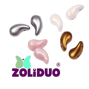 May include: A collection of teardrop-shaped beads in metallic silver, bronze, pearlescent white, and soft pink finishes. The beads feature two holes for threading. Below the beads is a logo with a butterfly icon and the text ZOLIDUO.