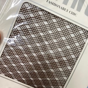 May include: Brown patterned hosiery in a clear plastic package. The hosiery has a repeating geometric design. The package reads "FASHIONABLY CHIC" and "KAYSER".