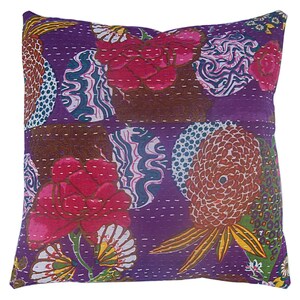 May include: Purple cotton throw pillow with a floral and geometric pattern. The pillow features a variety of colors, including pink, brown, green, and yellow.