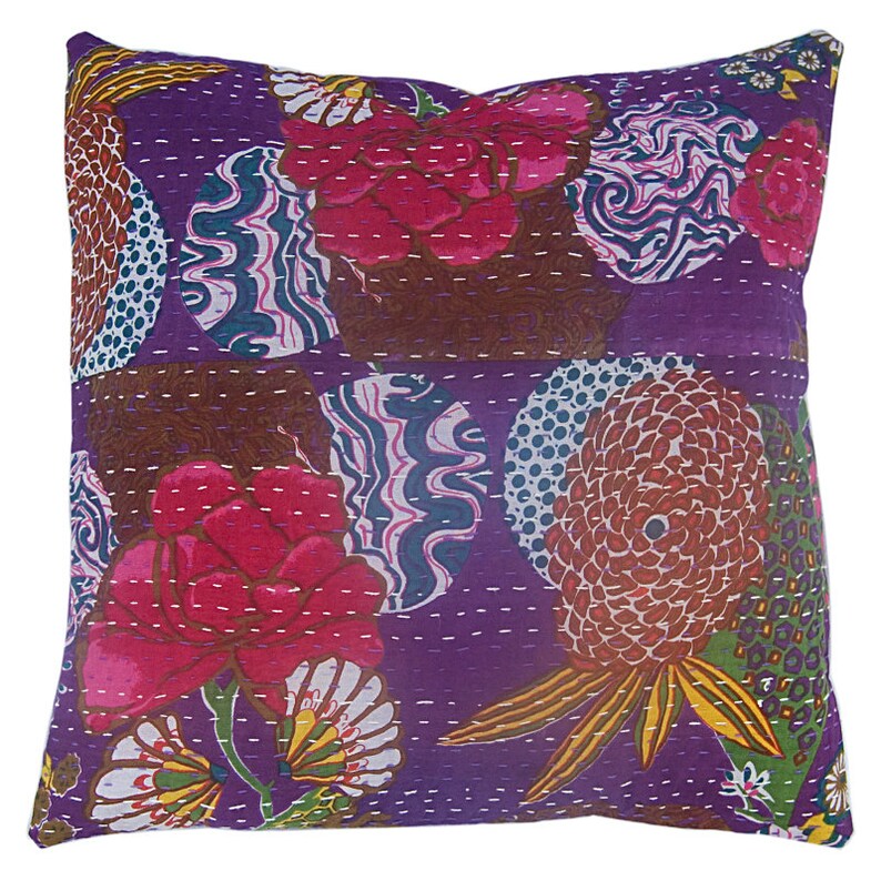 May include: Purple cotton throw pillow with a floral and geometric pattern. The pillow features a variety of colors, including pink, brown, green, and yellow.