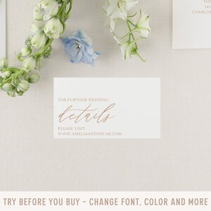 May include: A white card with the text "FOR FURTHER WEDDING details PLEASE VISIT WWW.AMELIAANDOSCAR.COM" in brown text.