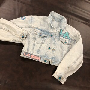 Vintage LA Gear 1990's denim jean jacket in an acid wash with textured logo patches image 1