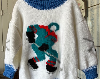 Vintage kids' handmade sweater, hand knit pullover (C462), blue and white sweater with hockey players, hockey theme