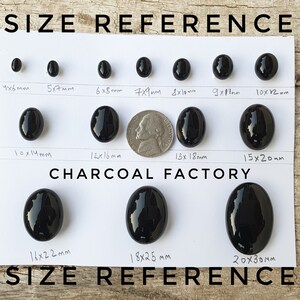May include: Size reference chart for black oval cabochons. The chart shows the dimensions of each cabochon in millimeters, ranging from 4x6mm to 20x30mm. The chart is labeled "CHARCOAL FACTORY".