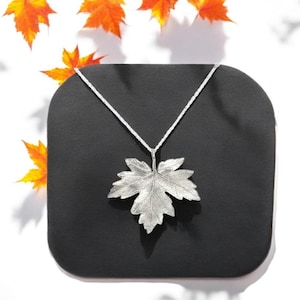 Maple leaf pendant in silver, Realistic botanical jewelry with leaf motif, Eye-catching nature-inspired necklace with silver chain