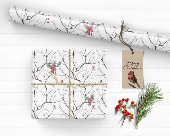 Accessories for packaging Christmas gift ,fir tree branch with red,  wrapping paper, roll of Red and white thread , christmas candy and  different wrap presents. Stock Photo