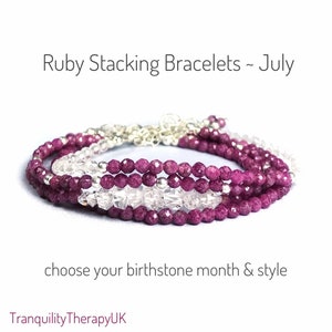 May include: A stack of bracelets made with ruby and clear quartz beads. The bracelets are layered and feature silver accents. Ruby Stacking Bracelets - July. Choose your birthstone month & style. TranquilityTherapyUK