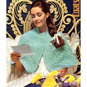 May include: A crochet pattern for a light blue baby quick knit coat. The pattern is from a vintage Carefree crochet booklet and is for sizes 34-38 inches.