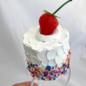Rainbow sprinkles cake, white fake cake, cake party hat