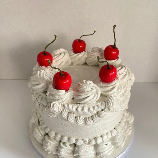 White fake cake, cherry cake, white faux cake