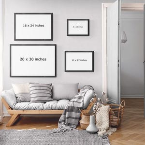 a living room with a couch and pictures on the wall
