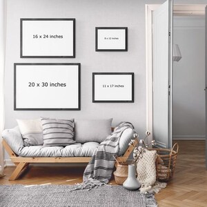 a living room with a couch and pictures on the wall