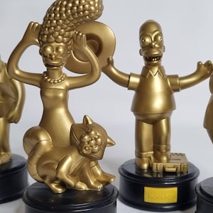Set of 4 Golden Figurines “The Simpsons Movie”, Matt Groening, Special Burger King Edition (Spanish voice)